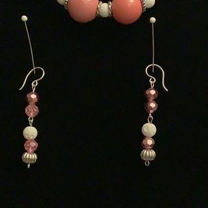 A 22 inch necklace with 2&1/4 inch earrings.Which are sterling silver